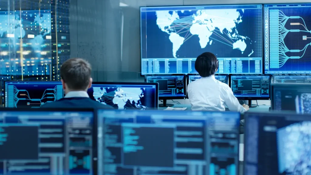 group of security experts looking at screen