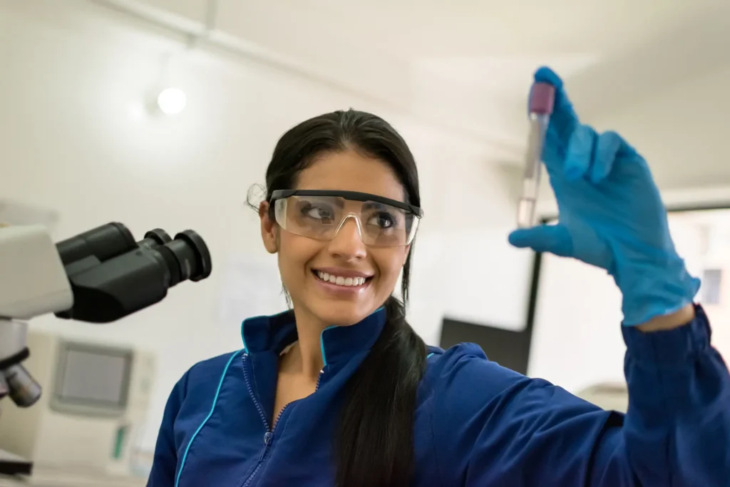 young female healthcare worker testing blood sample