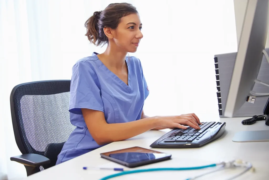 female healthcare worker working on the computer